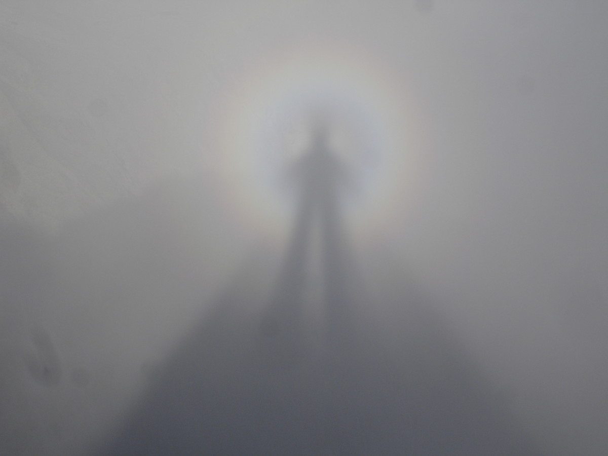 A Mountain Spectre phenomenon with man and glowing halo