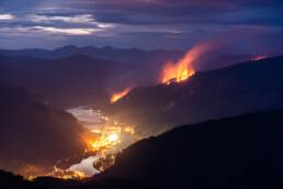 a forest fire burns near Castlegar, British Columbia, in 2018